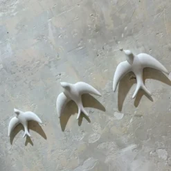 Trio of White Swallows