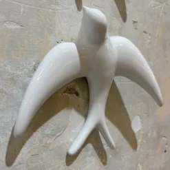 Trio of White Swallows